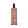 Spray corporel doré Glitterain Essencelle par Chogan avec parfum de monoï et lait, flacon de 150 ml visible.